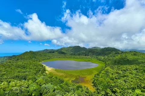 Aerial view of Grand Etang crater lake surrounded by rainforest, Grenada